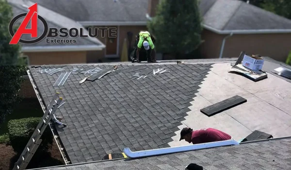 two men repairing a house roof